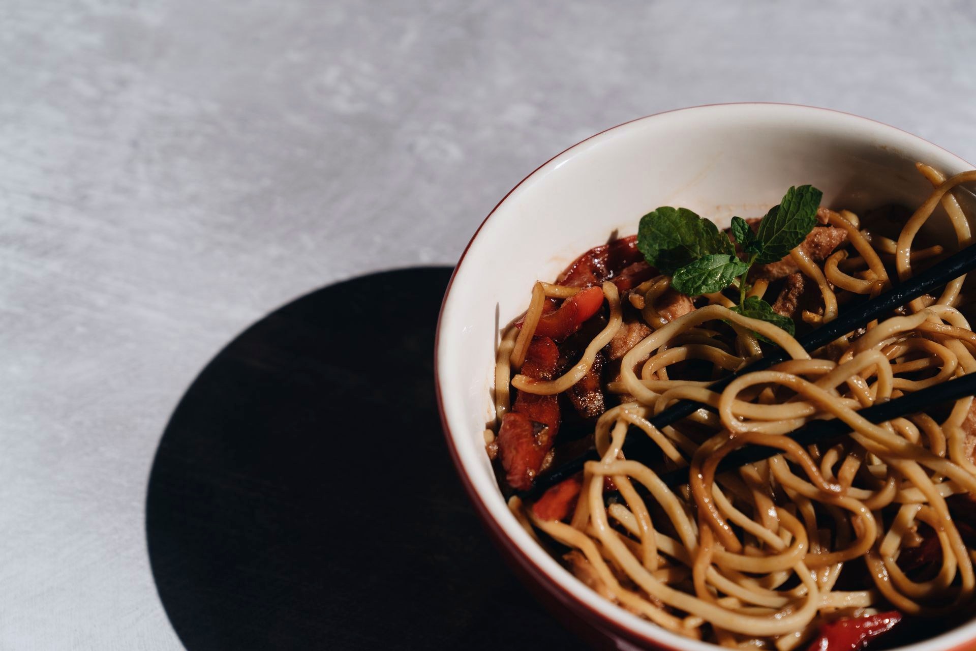 Spaghetti served on a dark plate