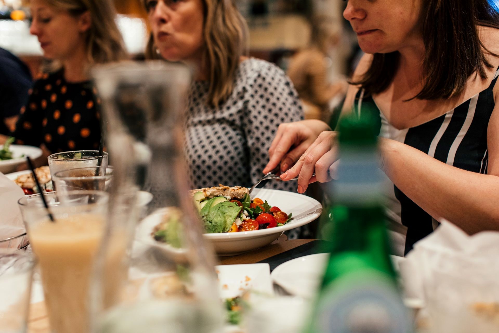 A table of people eating together