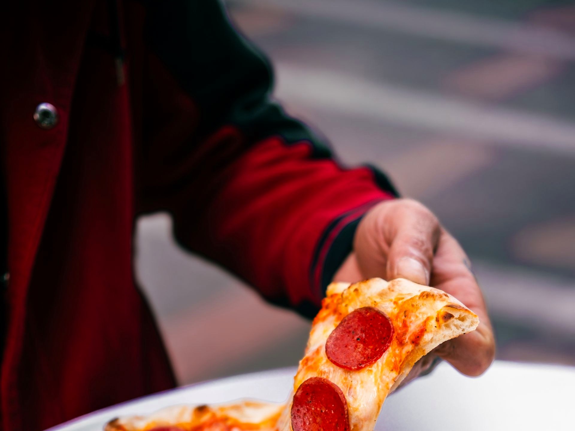 Menu — Pizza Two slices of pizza on a table